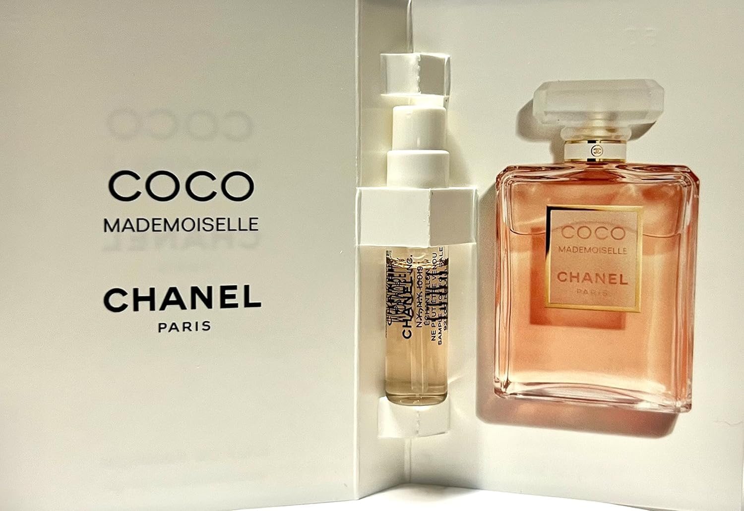 CHANEL vial beside passport and lipstick suggesting travel-ready convenience