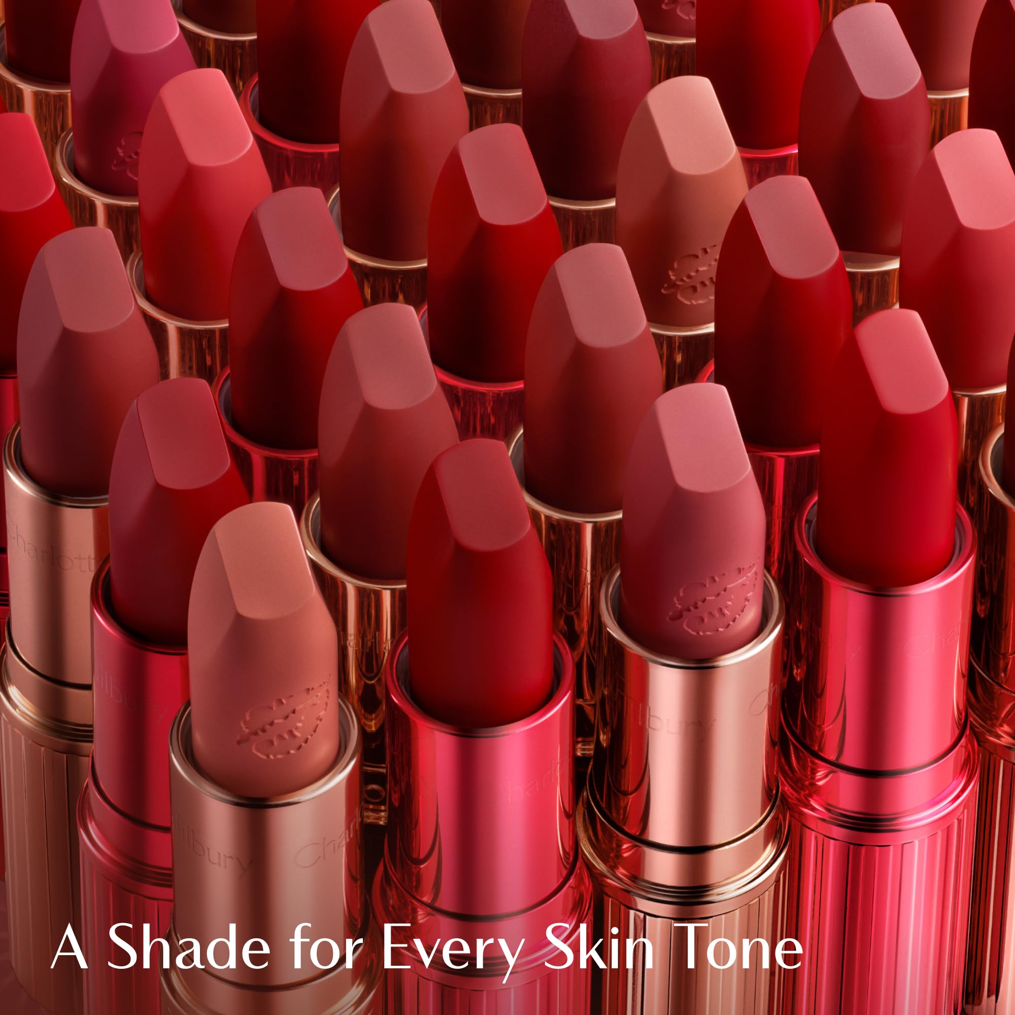 Charlotte Tilbury lipstick in hand demonstrating one-swipe coverage benefit