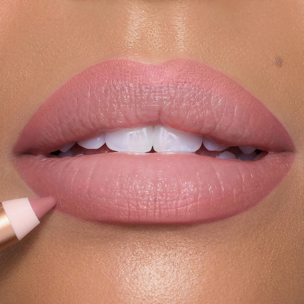 Charlotte Tilbury Pillow Talk swatch on arm showing true nude-pink shade benefit