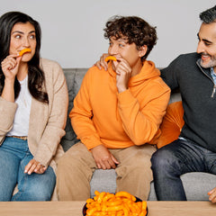 Hand holding Cheetos Crunchy Jalapeño Cheddar bag showing portability and flavor