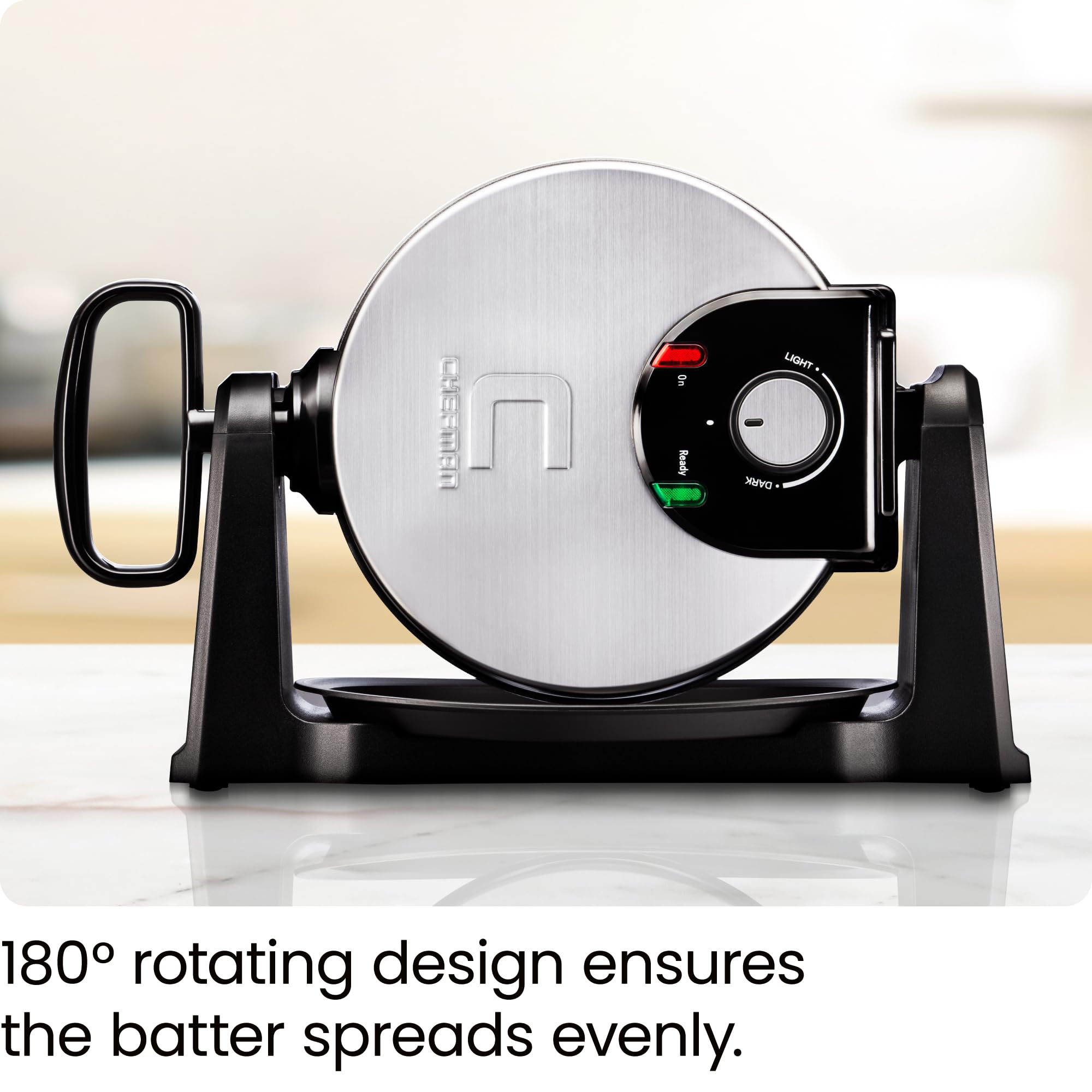 Chefman waffle maker in mid-180° flip demonstrating even batter distribution for uniform waffles