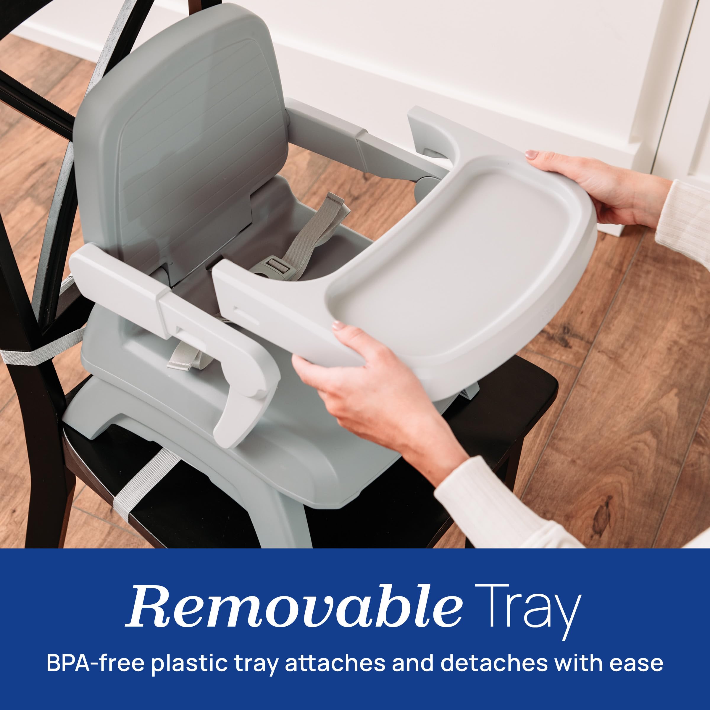 Chicco booster attached to dining chair demonstrating secure installation