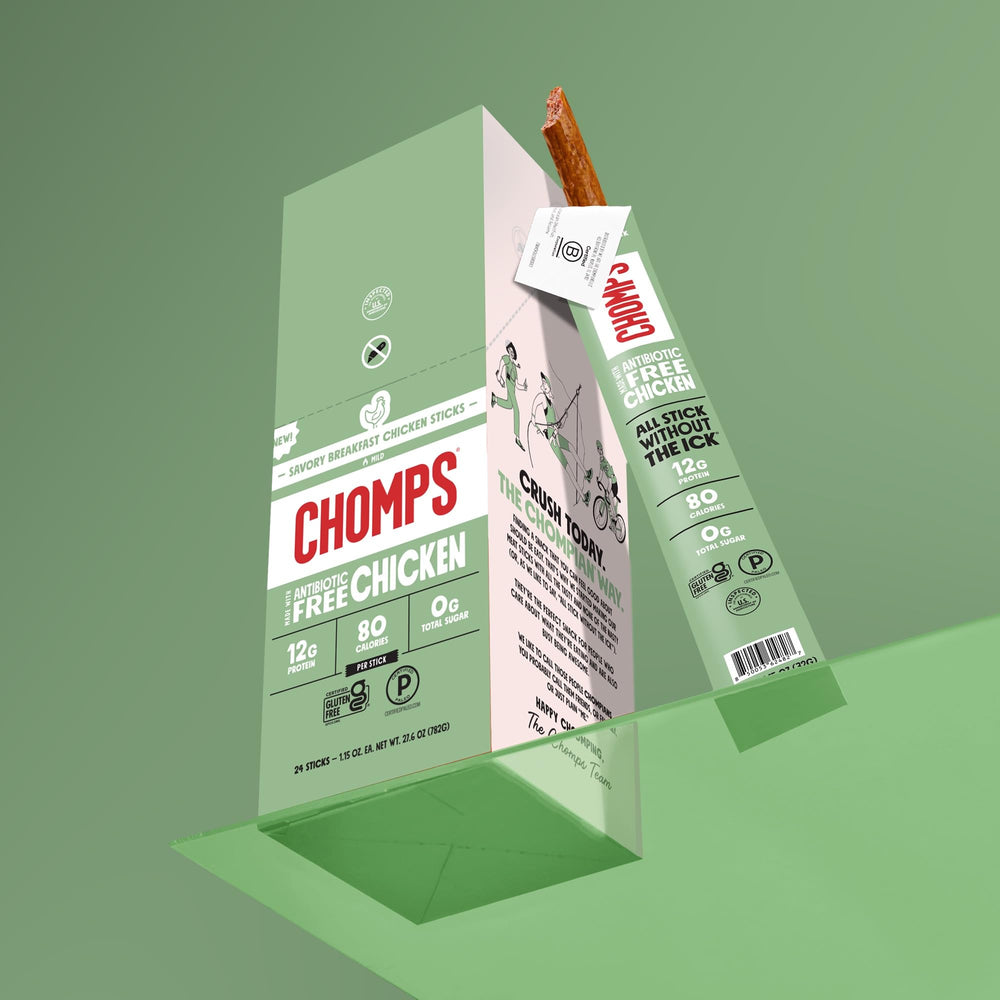 Chomps stick beside morning coffee demonstrating breakfast-flavored, on-the-go enjoyment