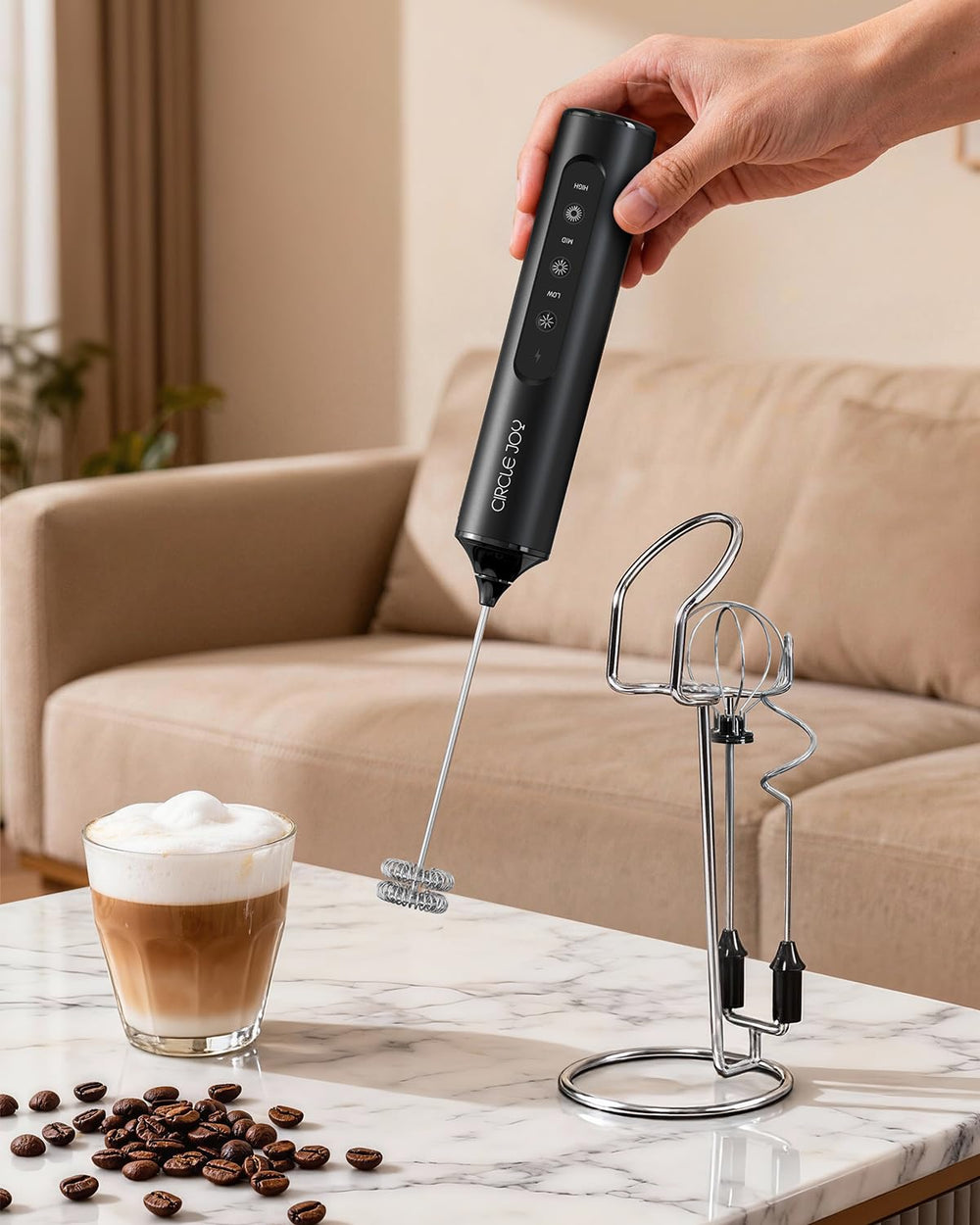 CIRCLE JOY frother beside cup showing compact size and portability