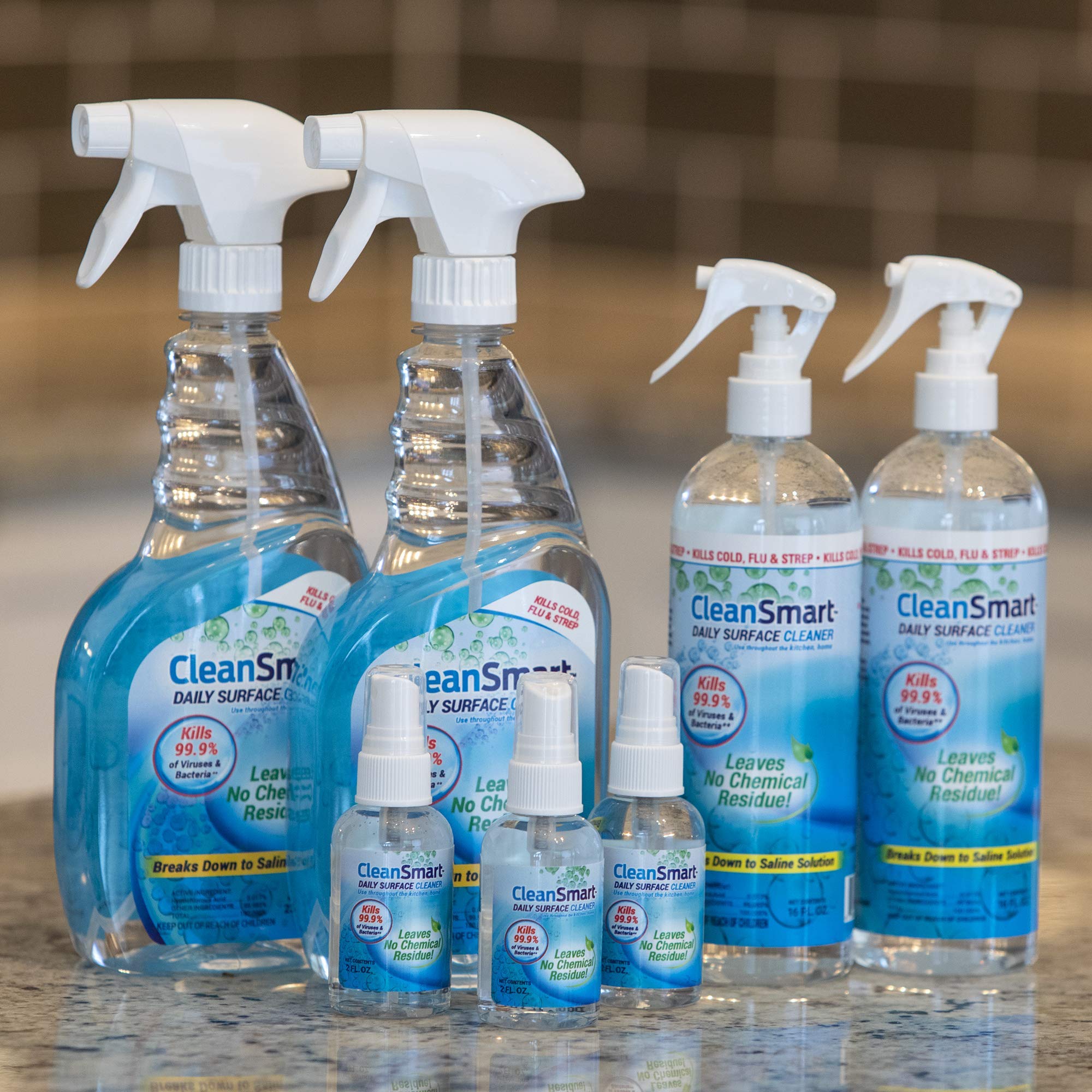 CleanSmart held in hand for scale showing compact bottle size and easy handling