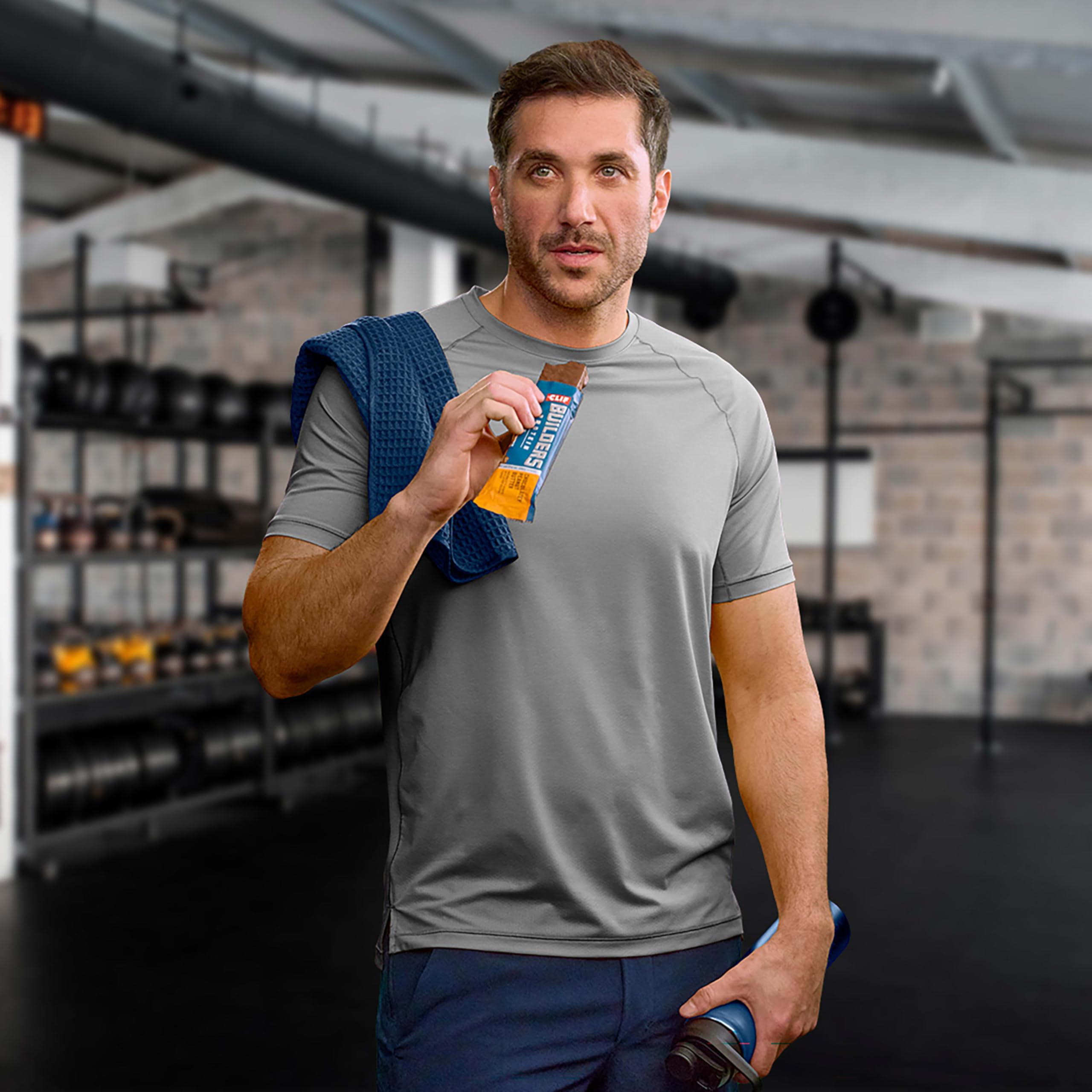 CLIF BUILDERS bar placed beside dumbbells illustrating workout recovery support