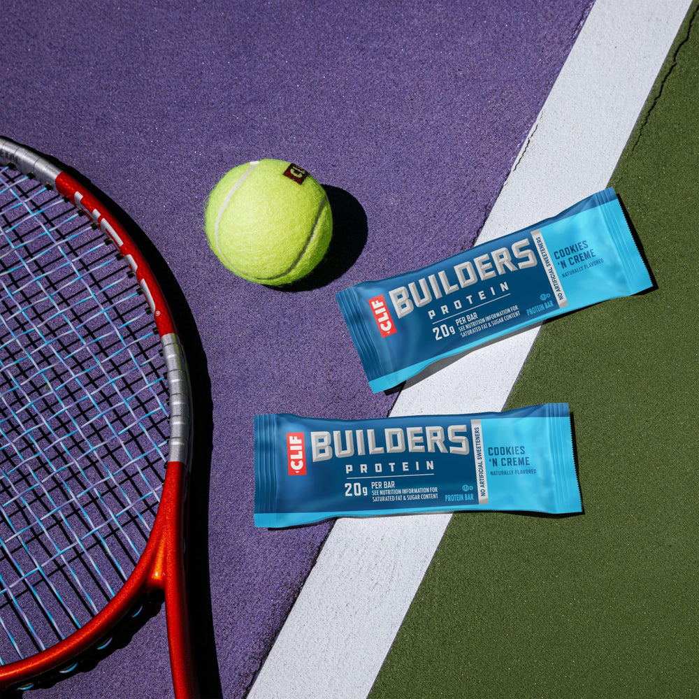 CLIF BUILDERS bar in hand for scale demonstrating compact, travel-friendly benefit