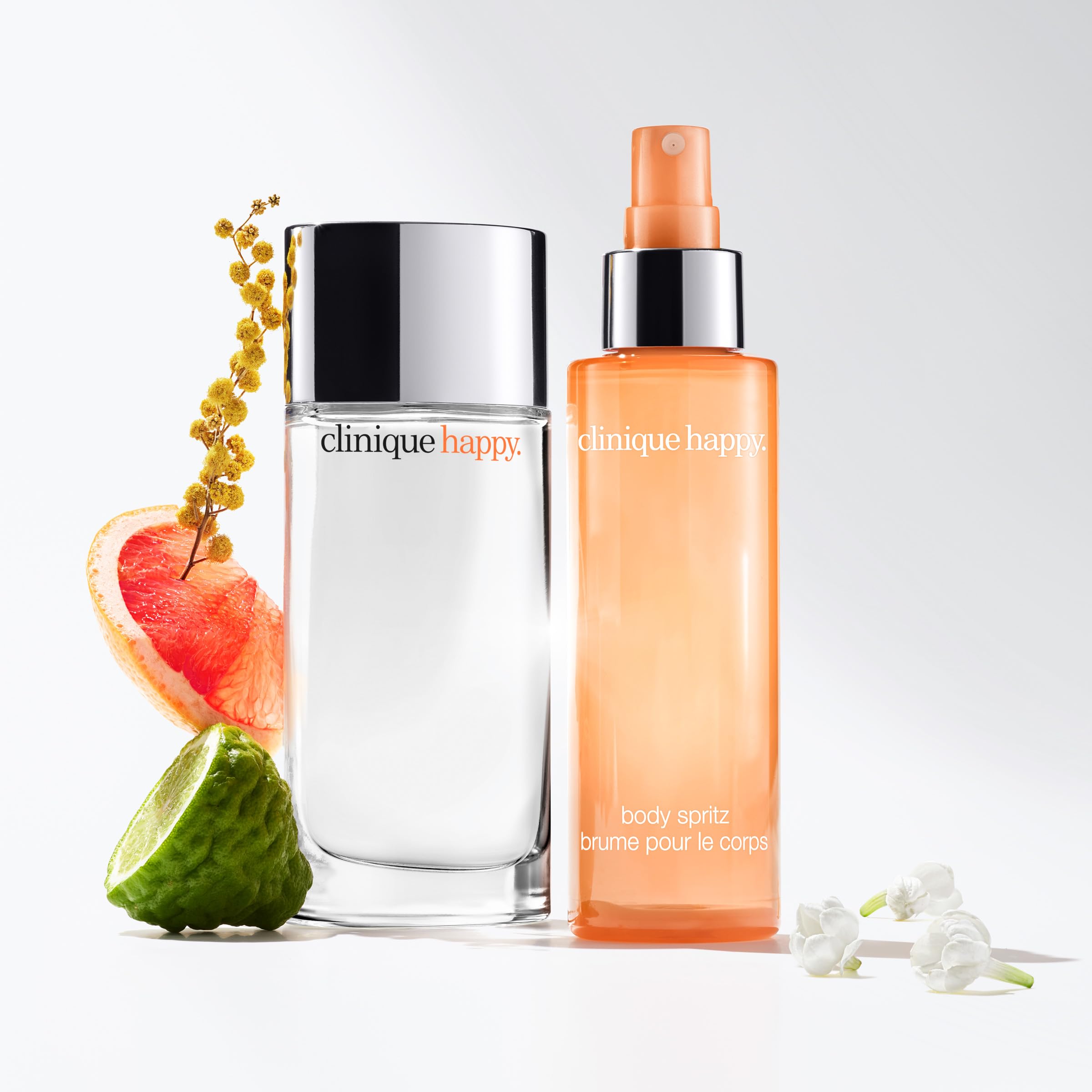 Clinique Happy Body Spritz outdoors in sunlight illustrating uplifting daytime wear