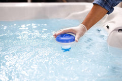 Clorox Pool&Spa tablets in floating feeder demonstrating convenient dispensing