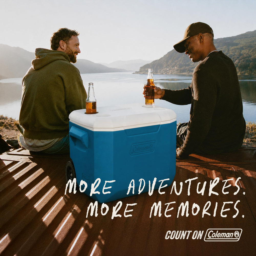Coleman cooler next to person to show size and scale for outdoor use