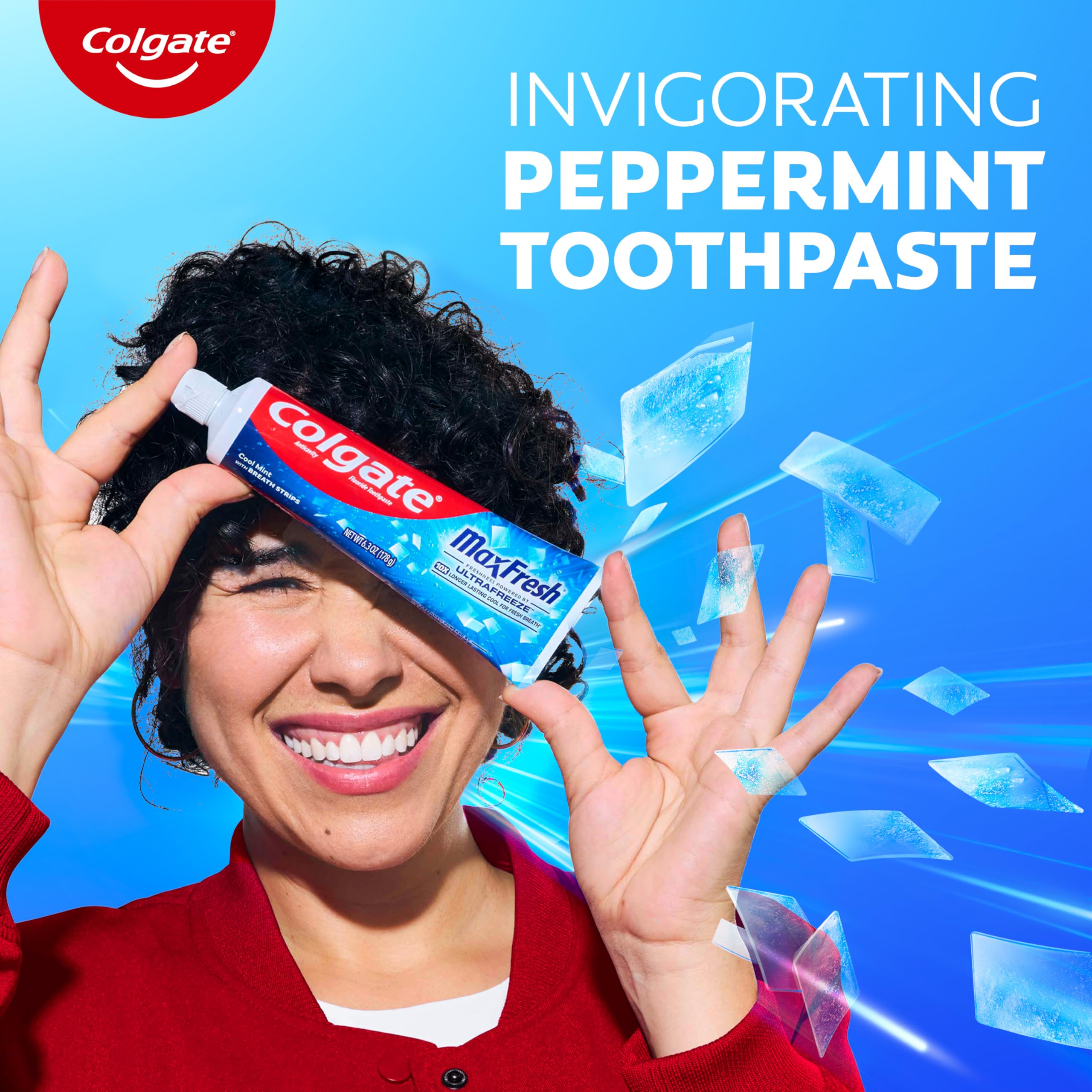 Colgate MaxFresh tubes arranged on a bathroom shelf indicating family-ready supply advantage