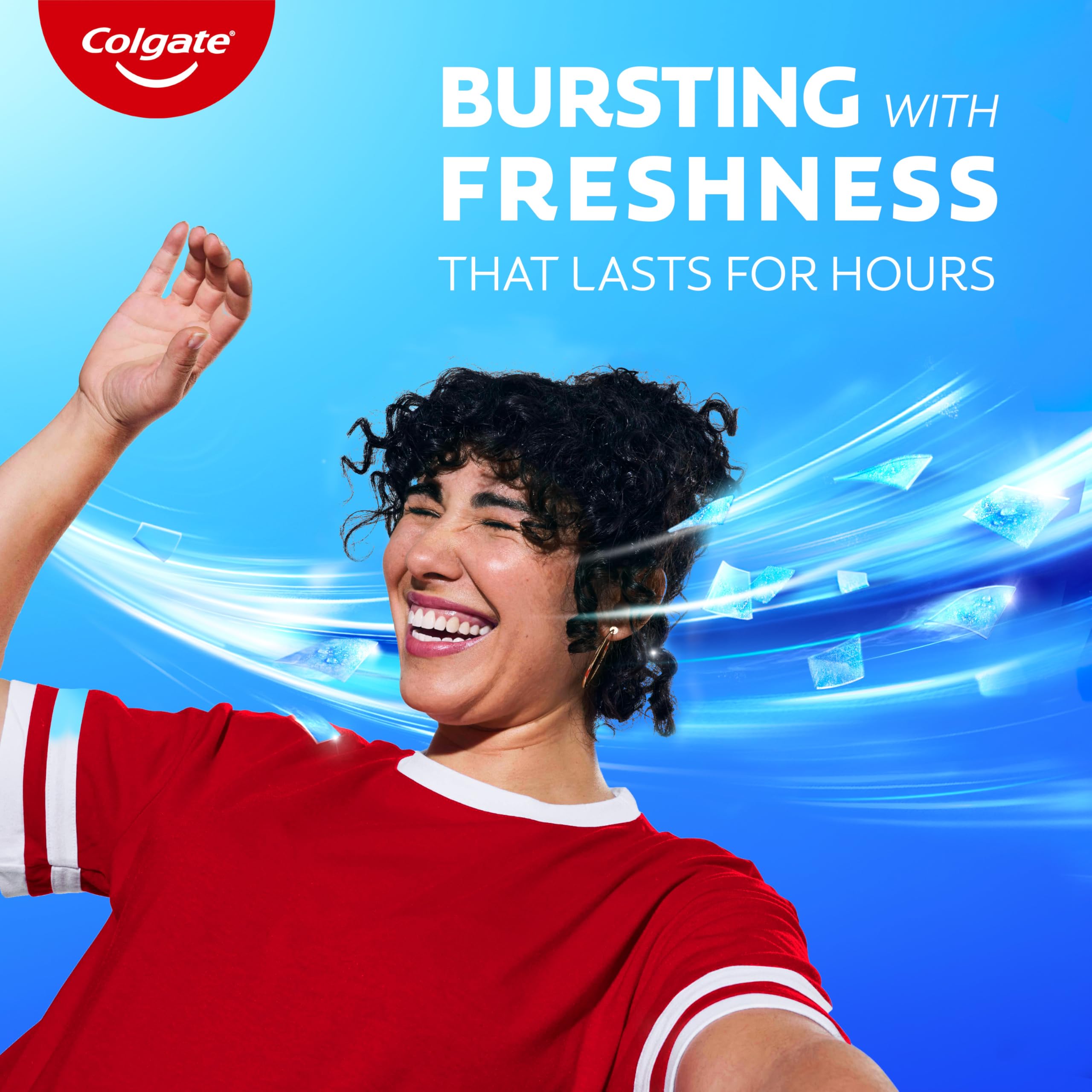 Colgate MaxFresh tube held in hand showing compact 1 oz size for TSA carry-on