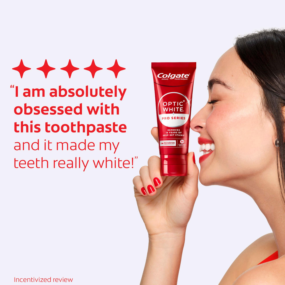 Colgate toothpaste on toothbrush at sink demonstrating daily use