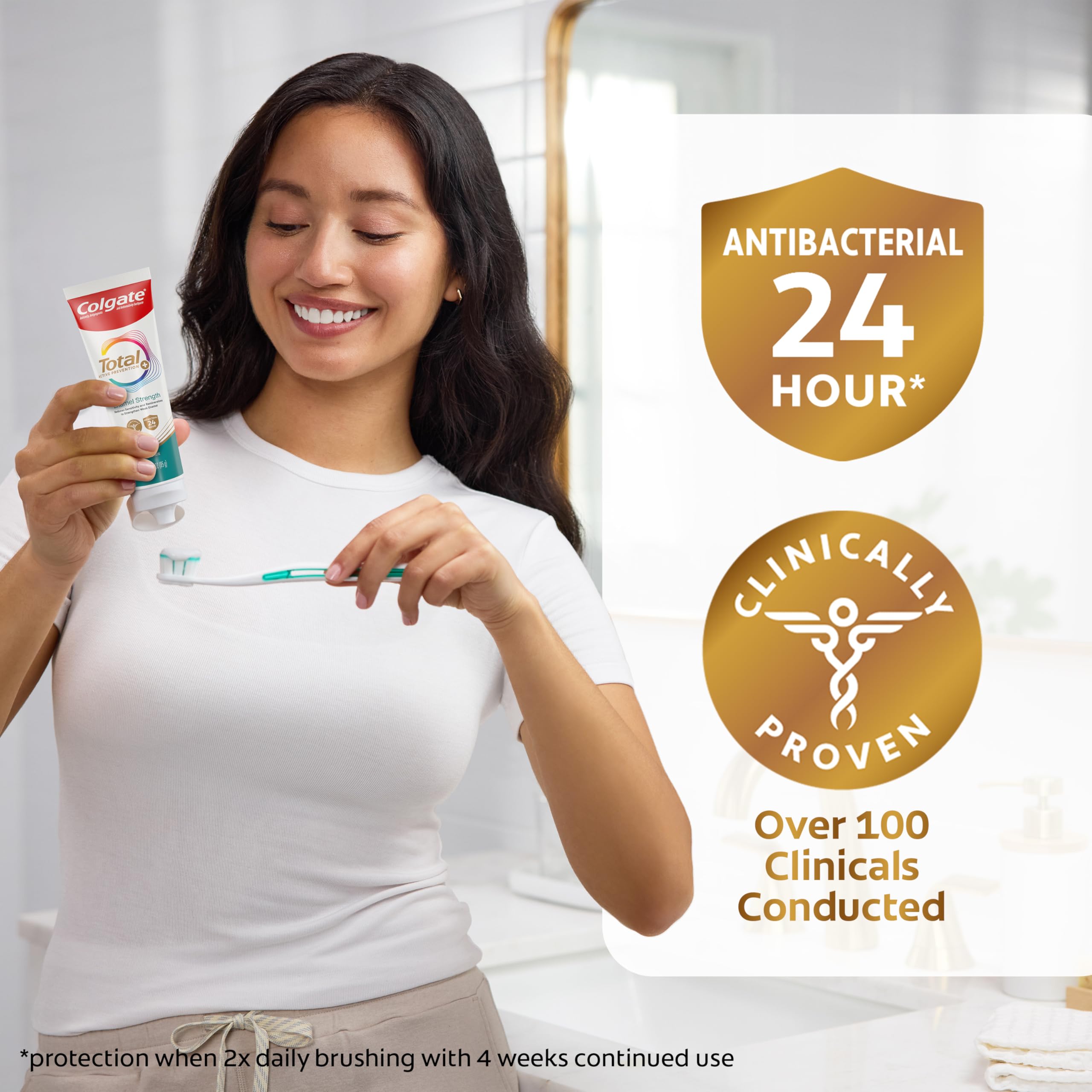 Person brushing teeth with Colgate to demonstrate daily enamel protection