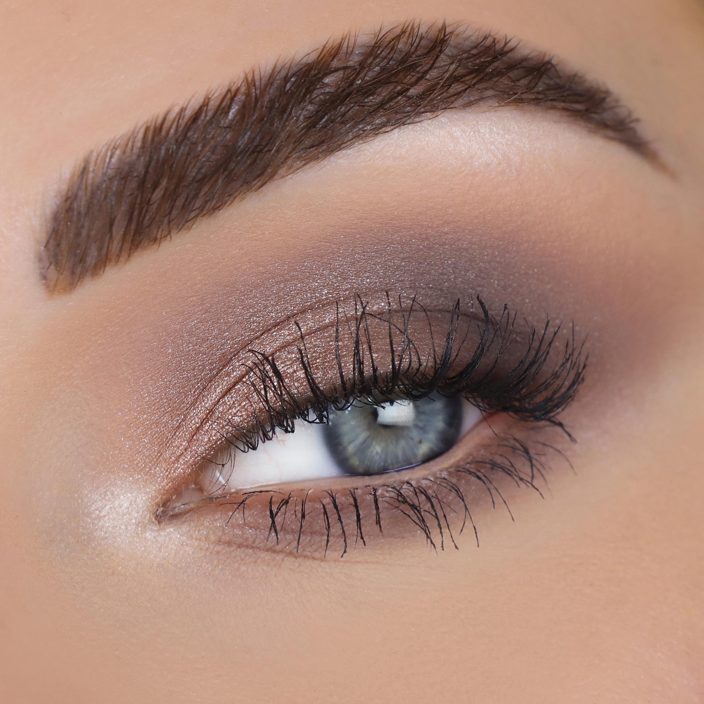ColourPop metallic shade swatched on arm showing sparkle payoff and glow benefit