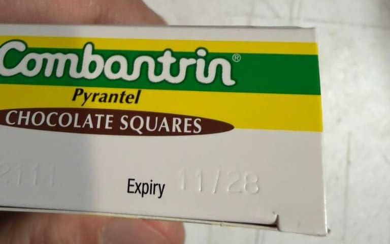 Combantrin chocolate square close-up showing texture and glossy finish with appetizing detail