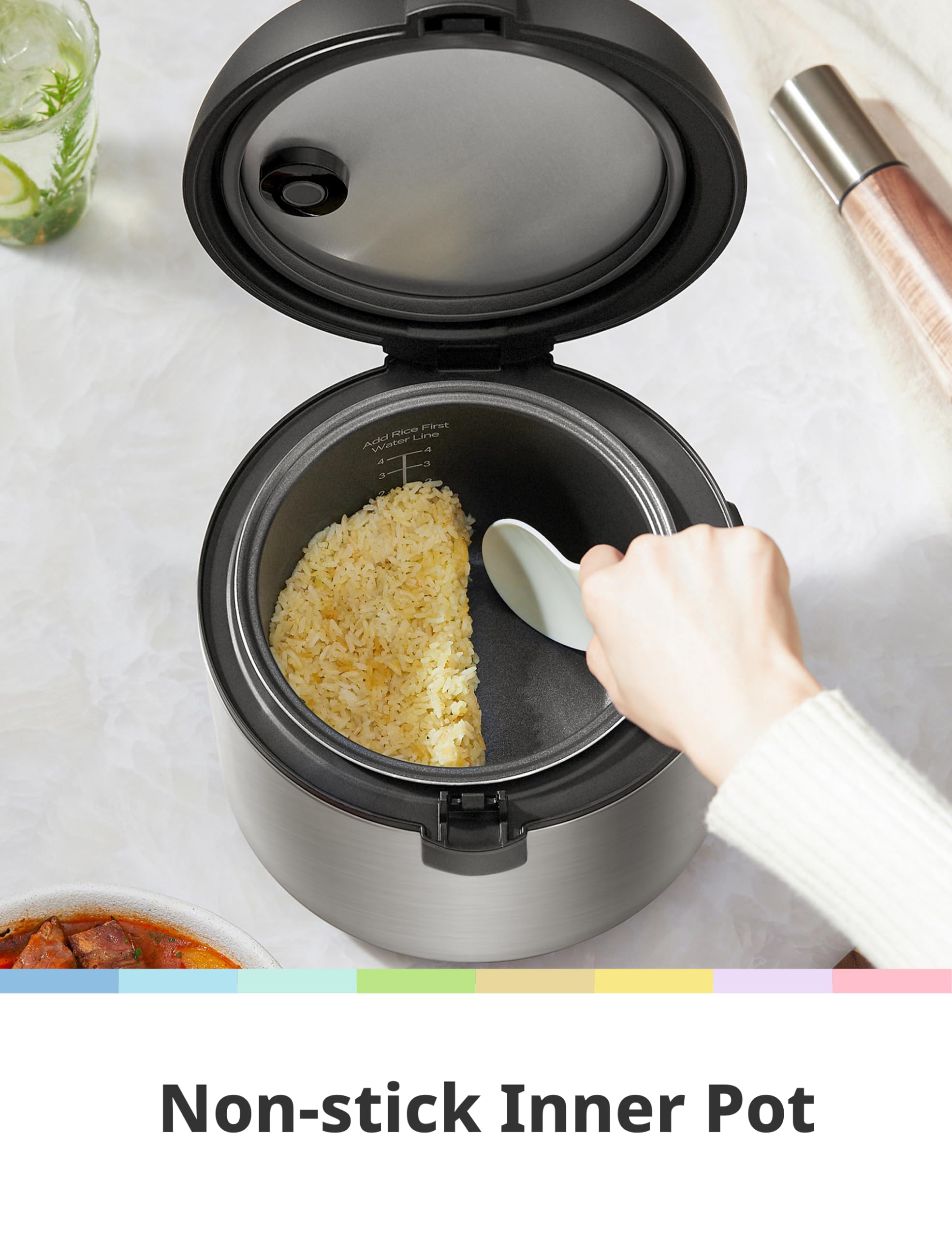 COMFEE' serving spatula and measuring cup next to cooker for accurate portions and serving