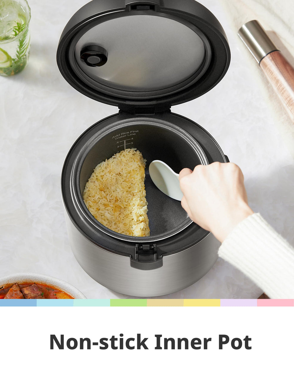 COMFEE' serving spatula and measuring cup next to cooker for accurate portions and serving
