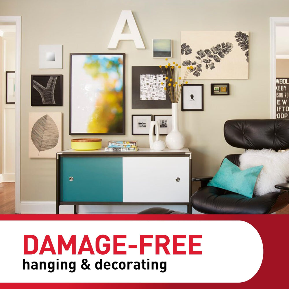 Command strips attached to frame and wall illustrating tool-free hanging and stable display