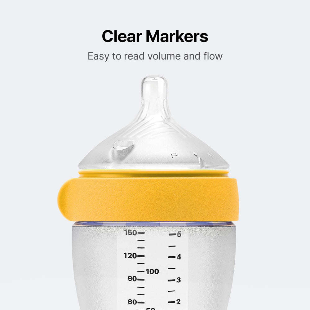 Comotomo bottle held during feeding illustrating comfortable latch