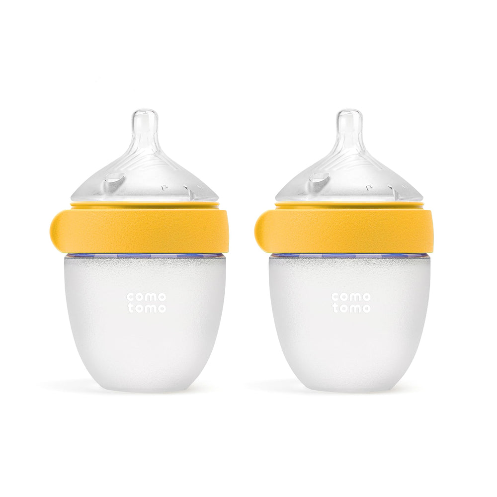 Comotomo front packaging showing two yellow 5oz bottles and benefits