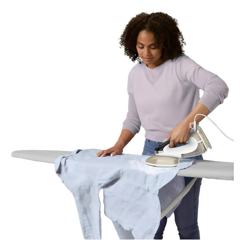 Conair ironing in use on table creating clean creases and polished finish