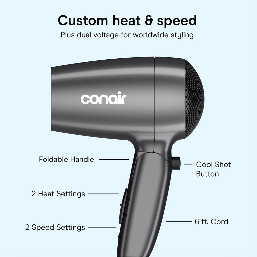 Conair held in hand to show size and lightweight comfort during use