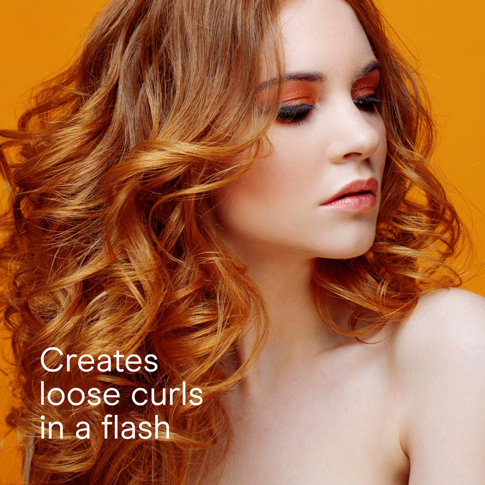 Conair curling iron in use on long hair creating loose, soft curls benefit