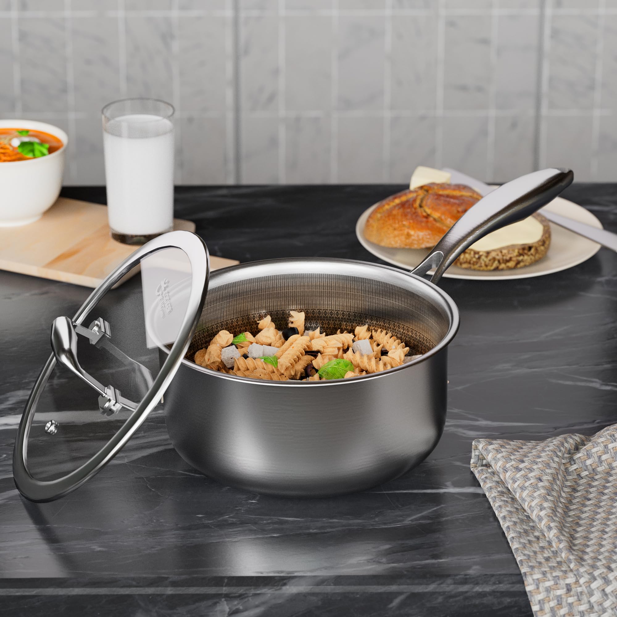COOKER KING saucepan beside measuring cup for scale, shows compact 3-quart capacity