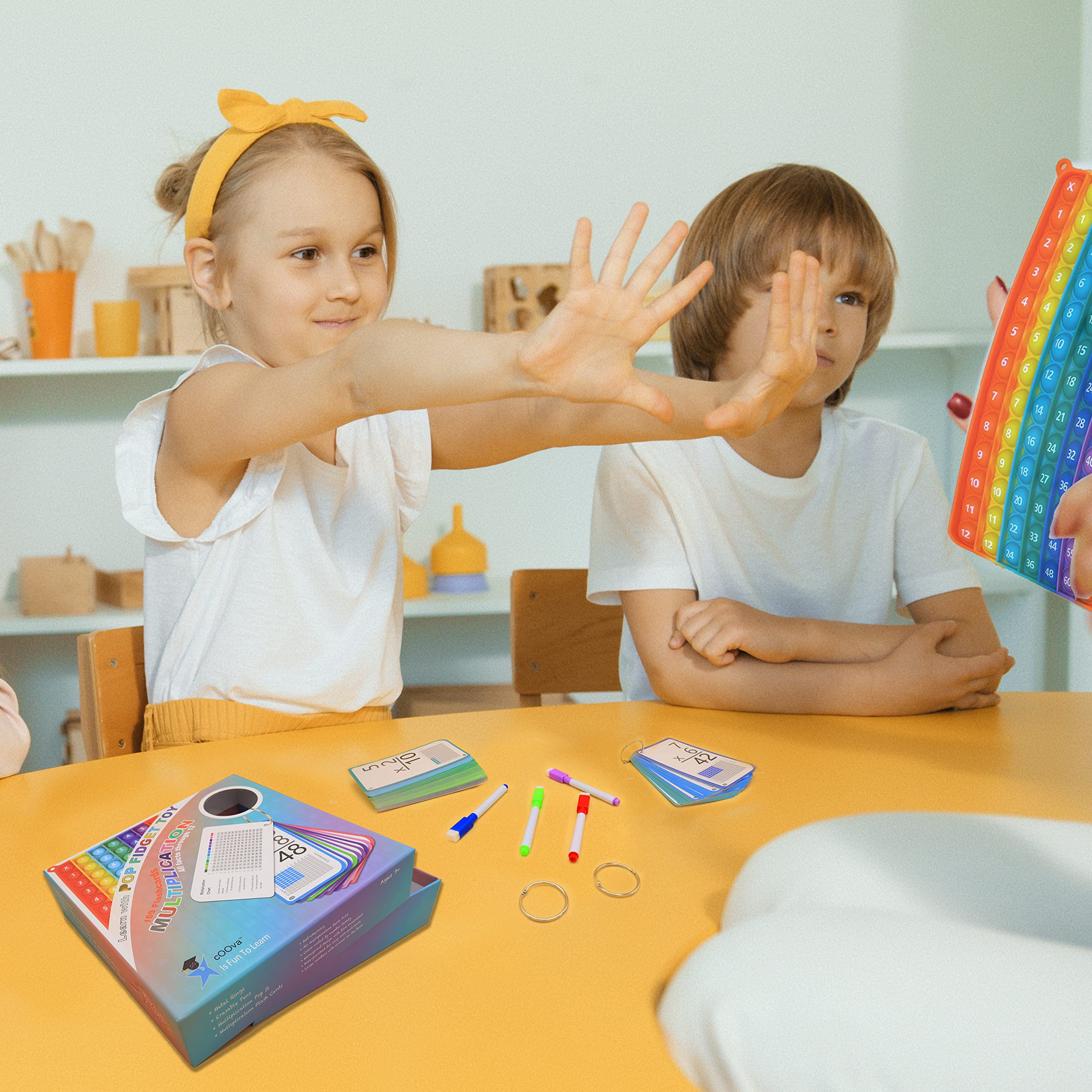 COOVA cards next to a pencil to show compact size and classroom convenience