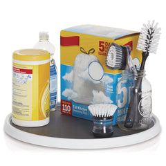 Copco installed under sink holding cleaning supplies to improve access and organization