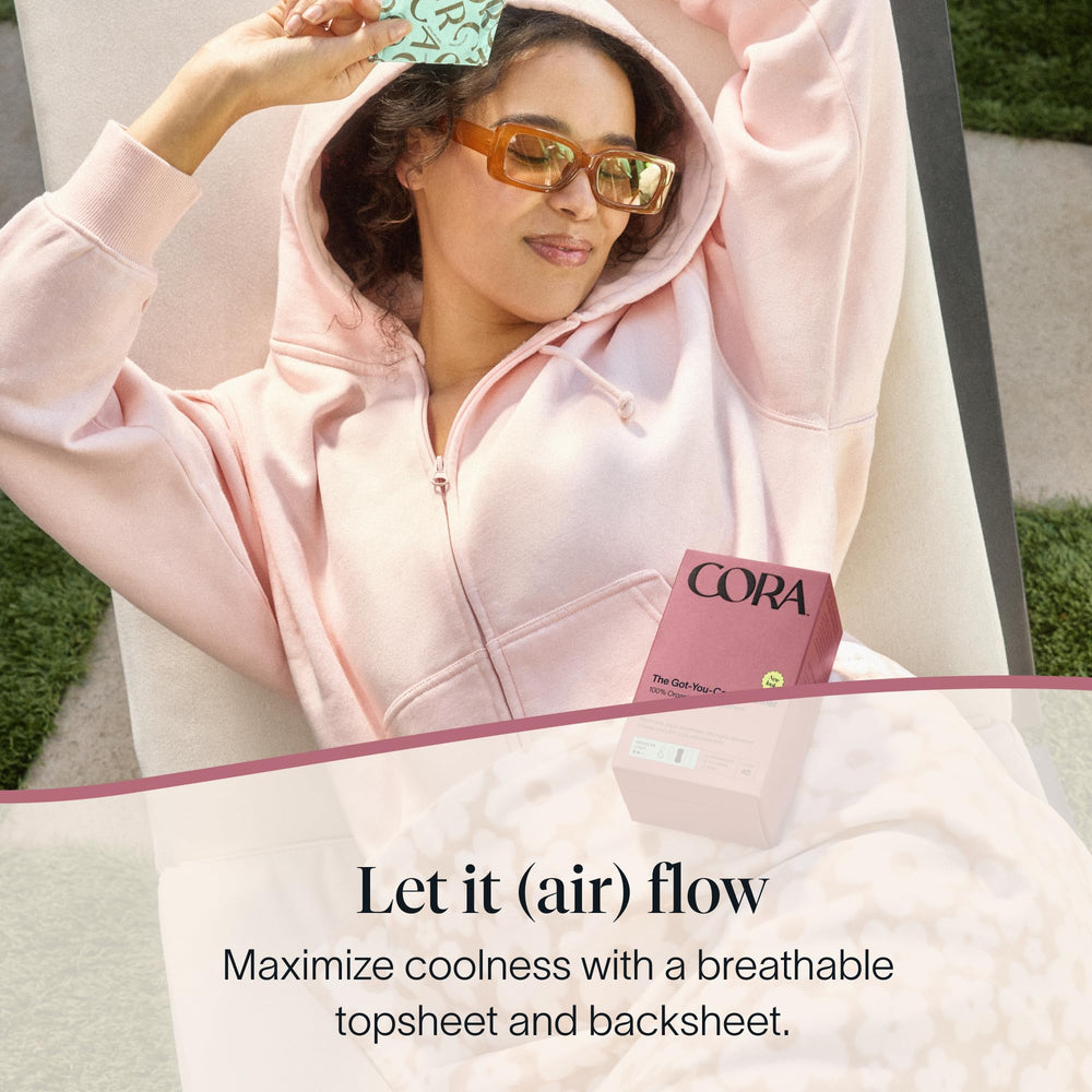 Cora individually wrapped liner opened for hygienic, discreet on-the-go use