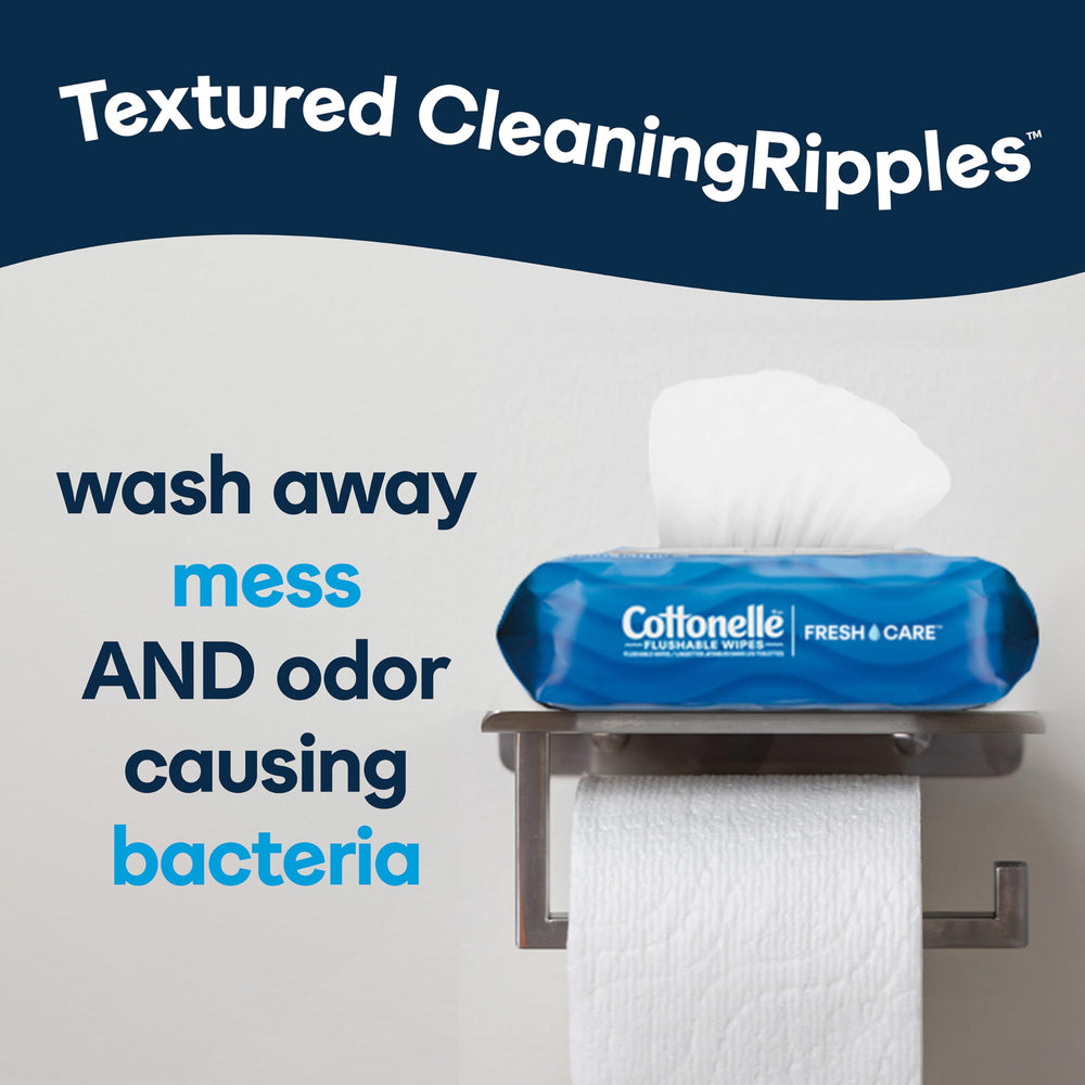 Person holding Cottonelle on-the-go pack demonstrating convenient portability