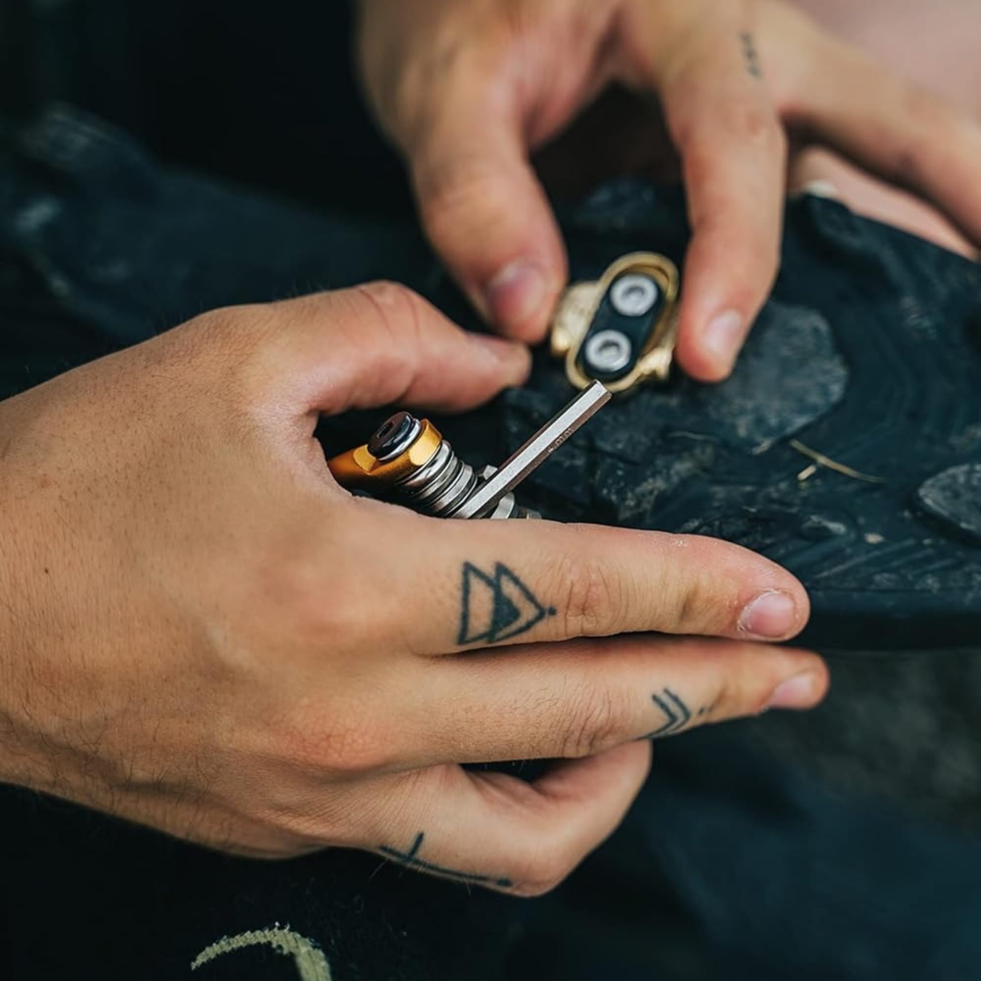 Crankbrothers Multi Tool in a saddle bag on a dirt trail highlighting portability for on-ride repairs benefit readiness