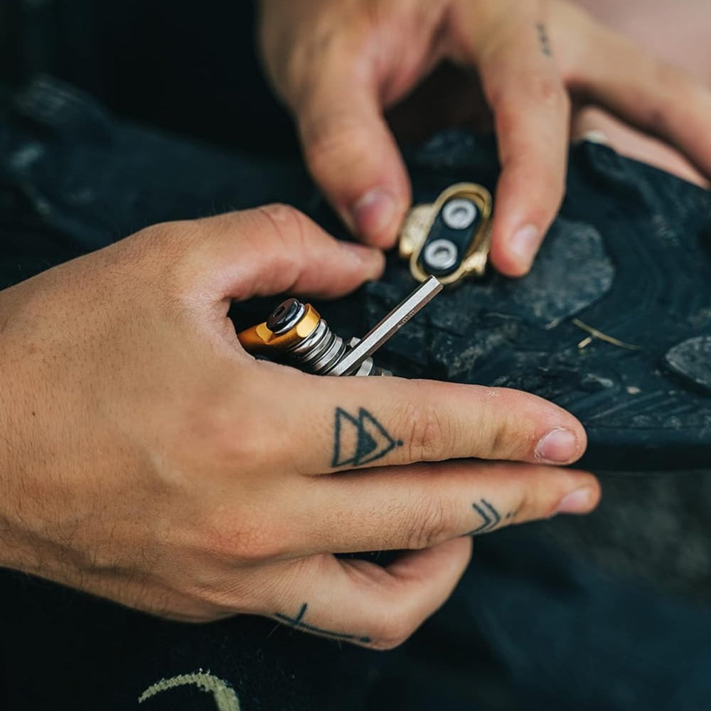 Crankbrothers Multi Tool in a saddle bag on a dirt trail highlighting portability for on-ride repairs benefit readiness