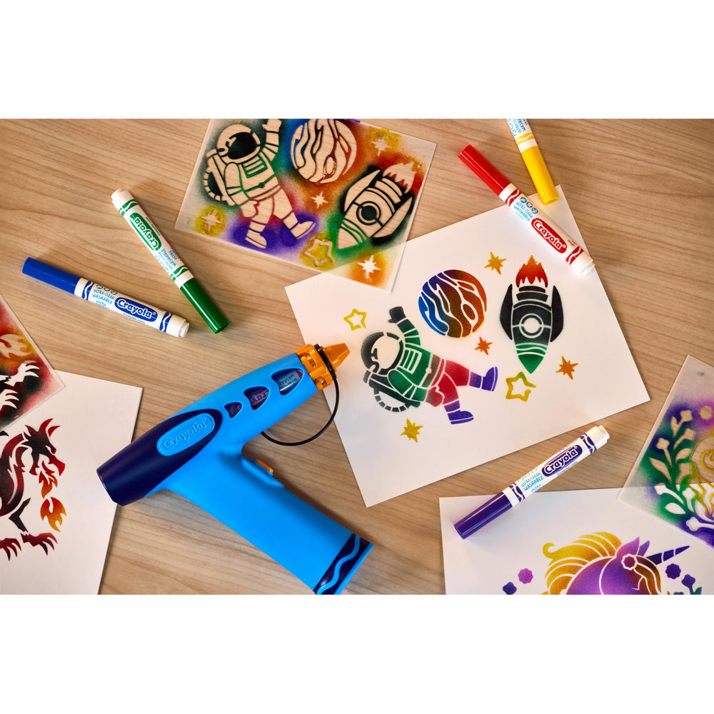 Crayola airbrush shown in hand for scale to confirm kid-friendly size