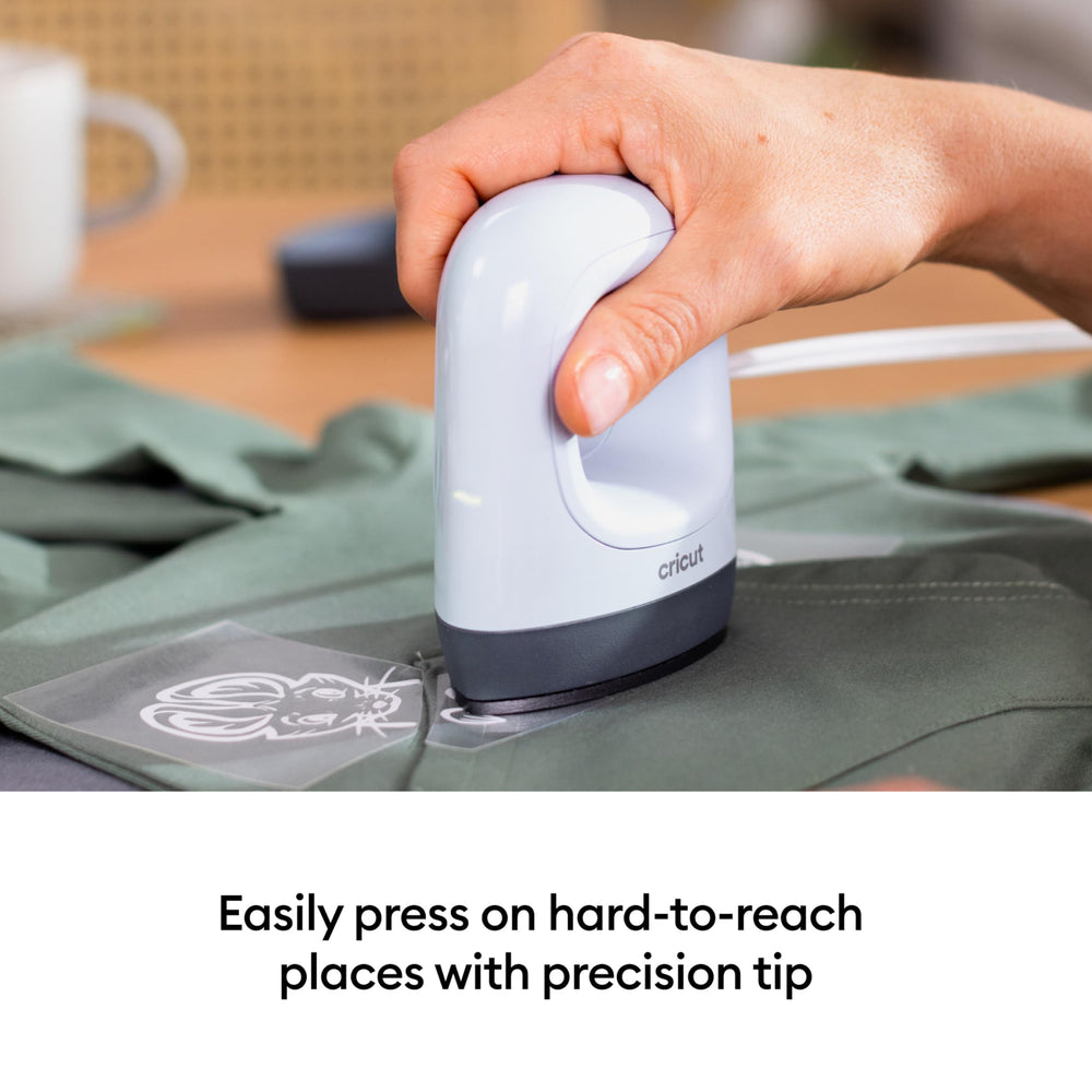 Cricut EasyPress Mini in use on baby onesie demonstrating gentle press for delicate fabrics