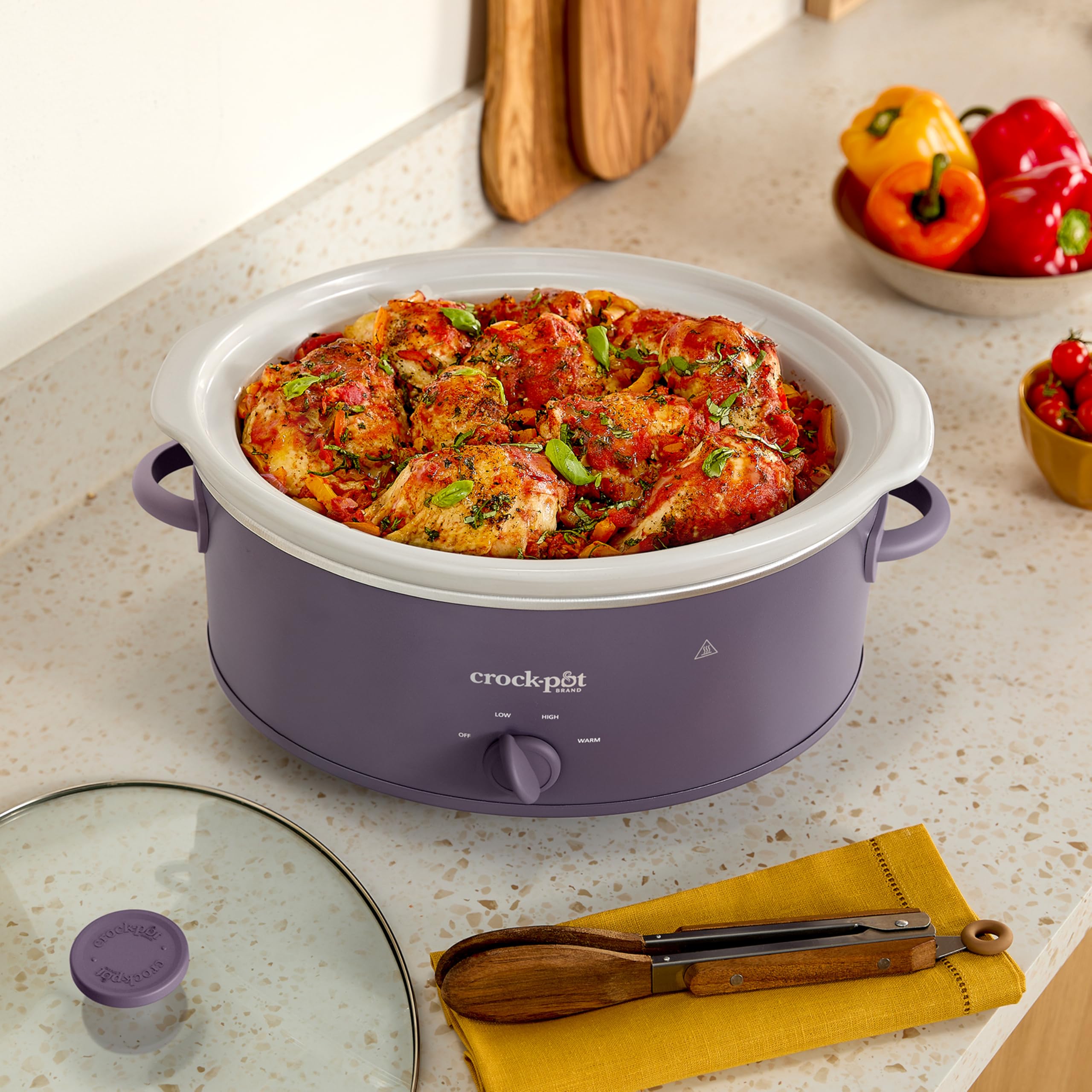 Crock-Pot beside measuring cup illustrating 7-quart capacity and portion planning convenience