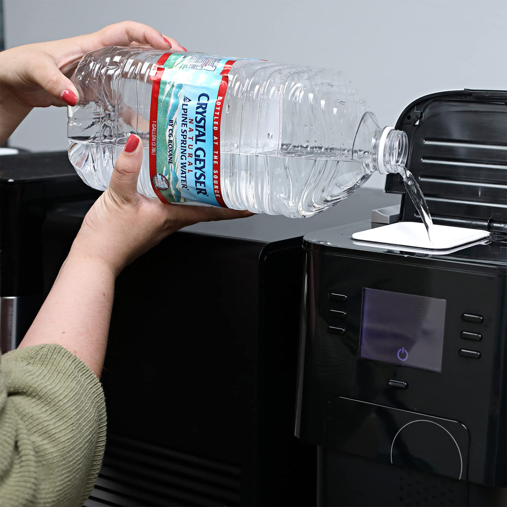 Crystal Geyser jugs on kitchen counter illustrating ready-to-use household hydration