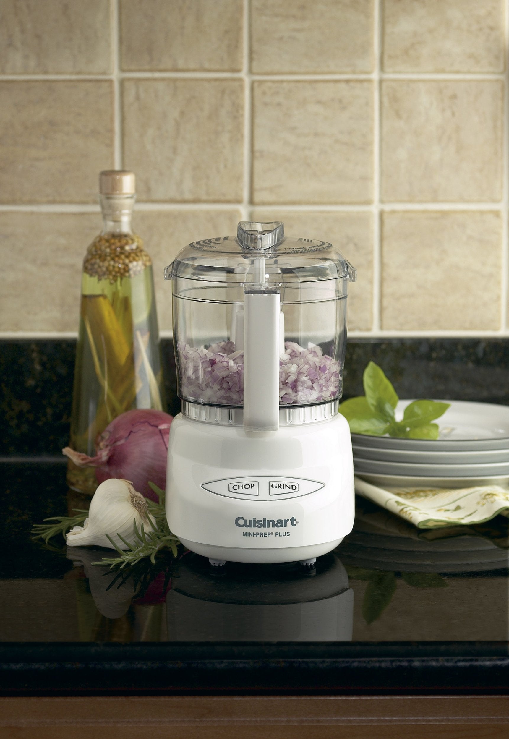 Cuisinart reversible stainless-steel blade close-up demonstrating sharp and blunt edges