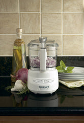 Cuisinart reversible stainless-steel blade close-up demonstrating sharp and blunt edges