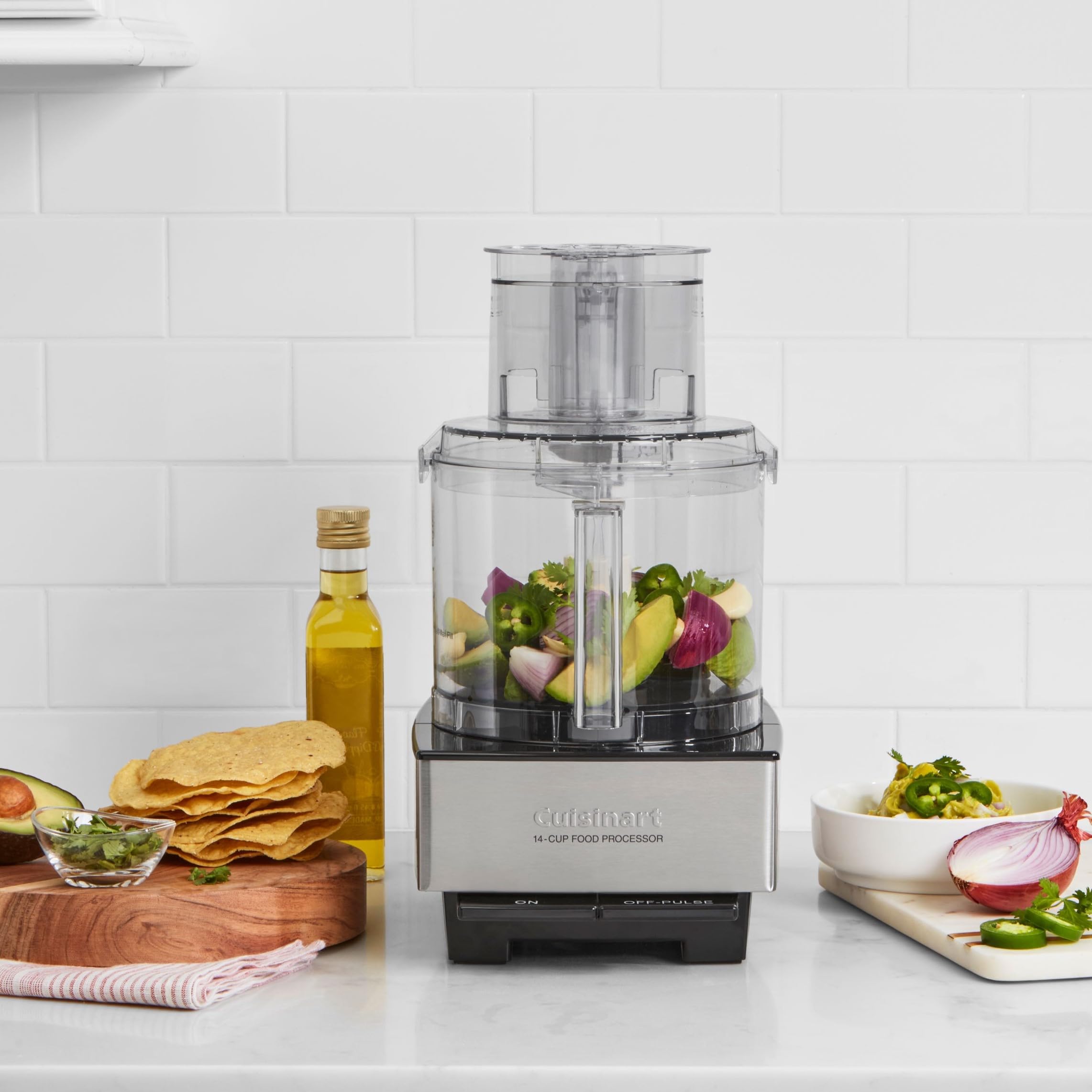 Cuisinart extra-large feed tube closeup, accepts whole produce easily