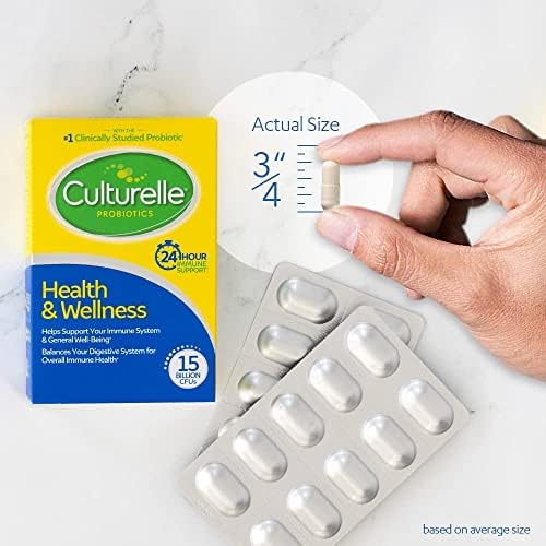 Culturelle capsule beside a glass of water showing how to take it