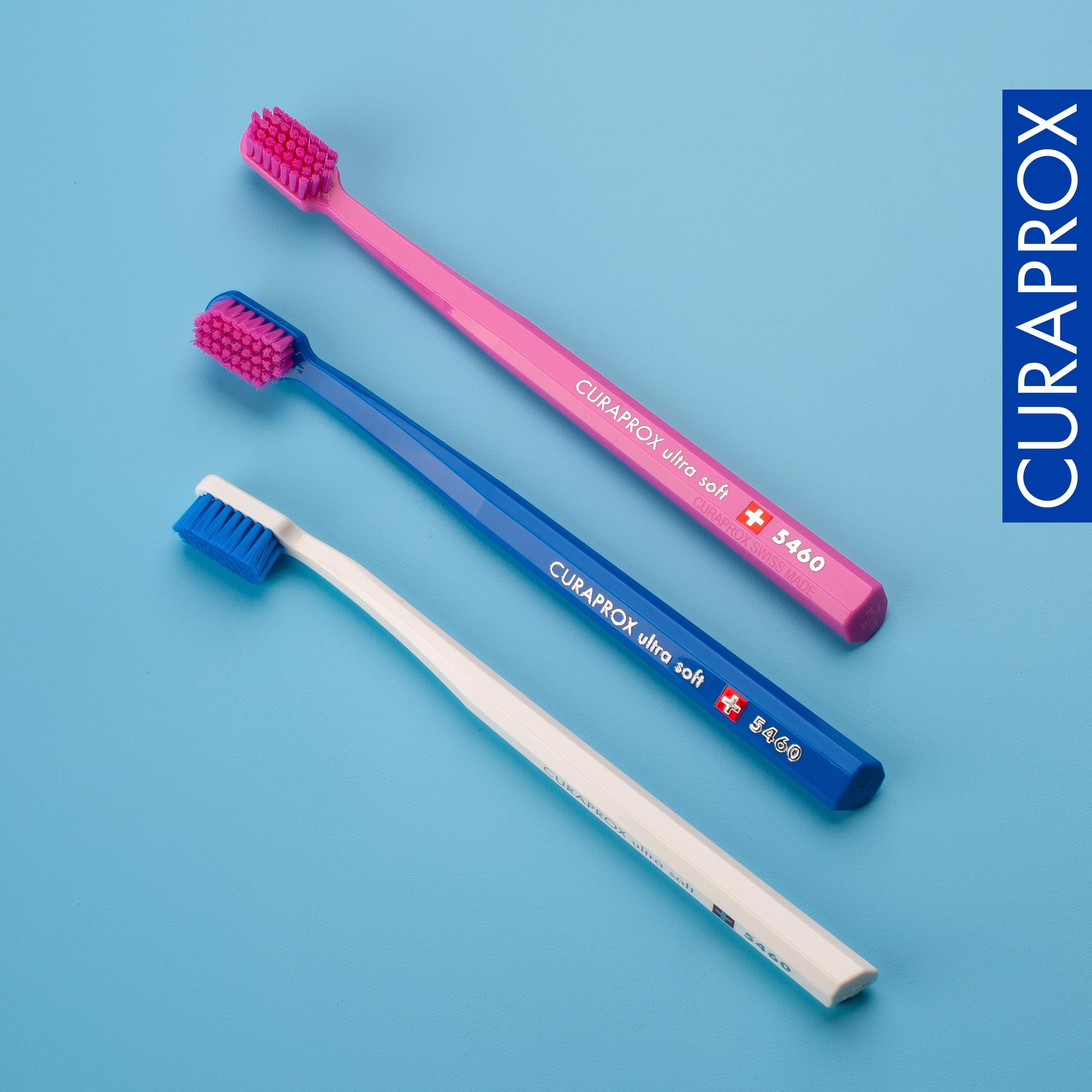 Curaprox CS 5460 three-pack laid out to show color variety and spare brush convenience