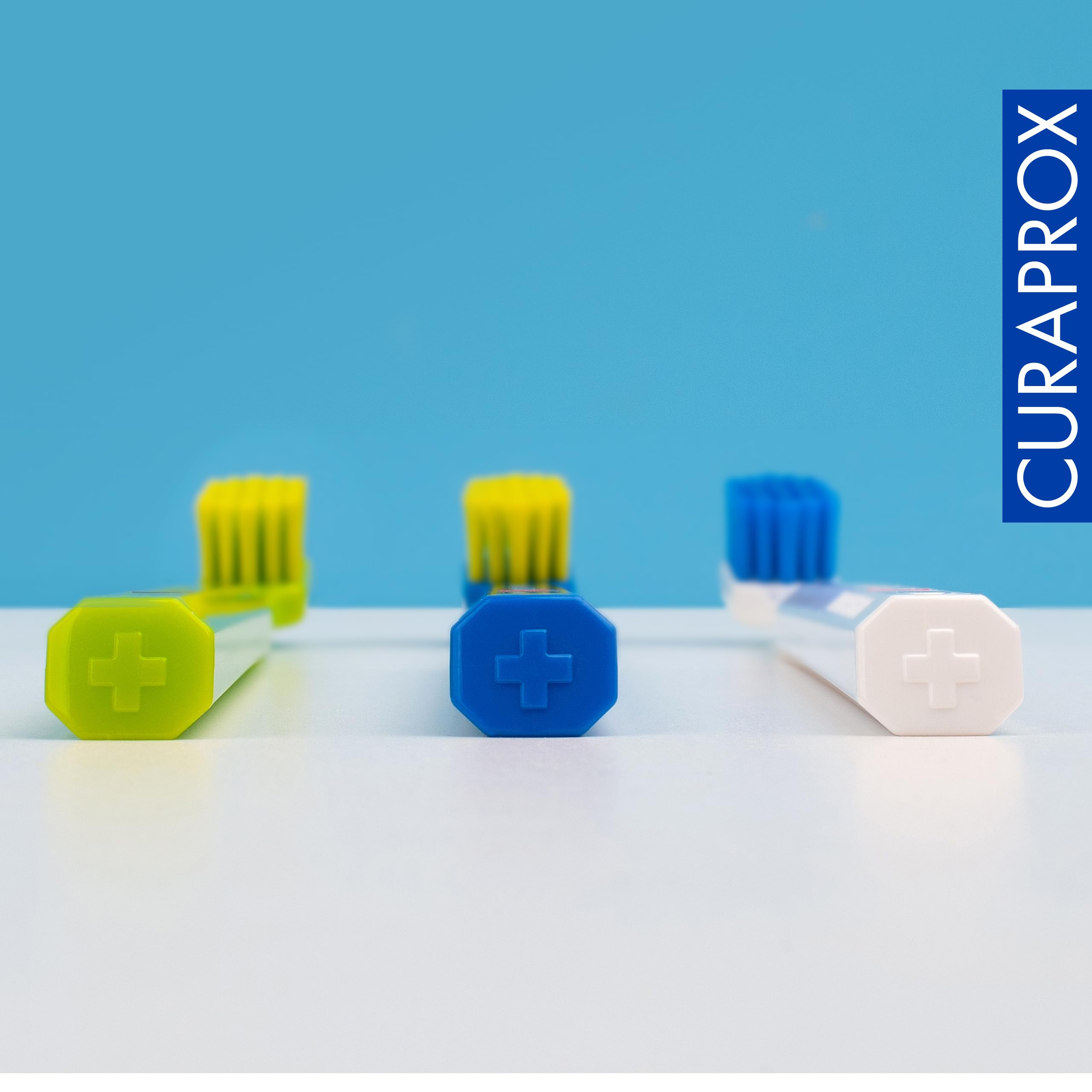 Curaprox CS 5460 packed for travel next to a case, illustrating portability and hygiene