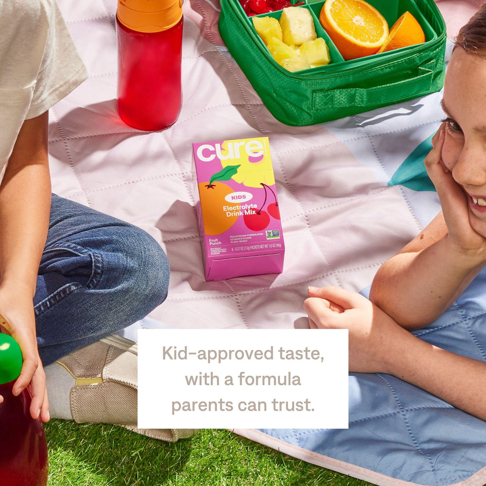 Cure Hydration packet in backpack showing portability for busy families