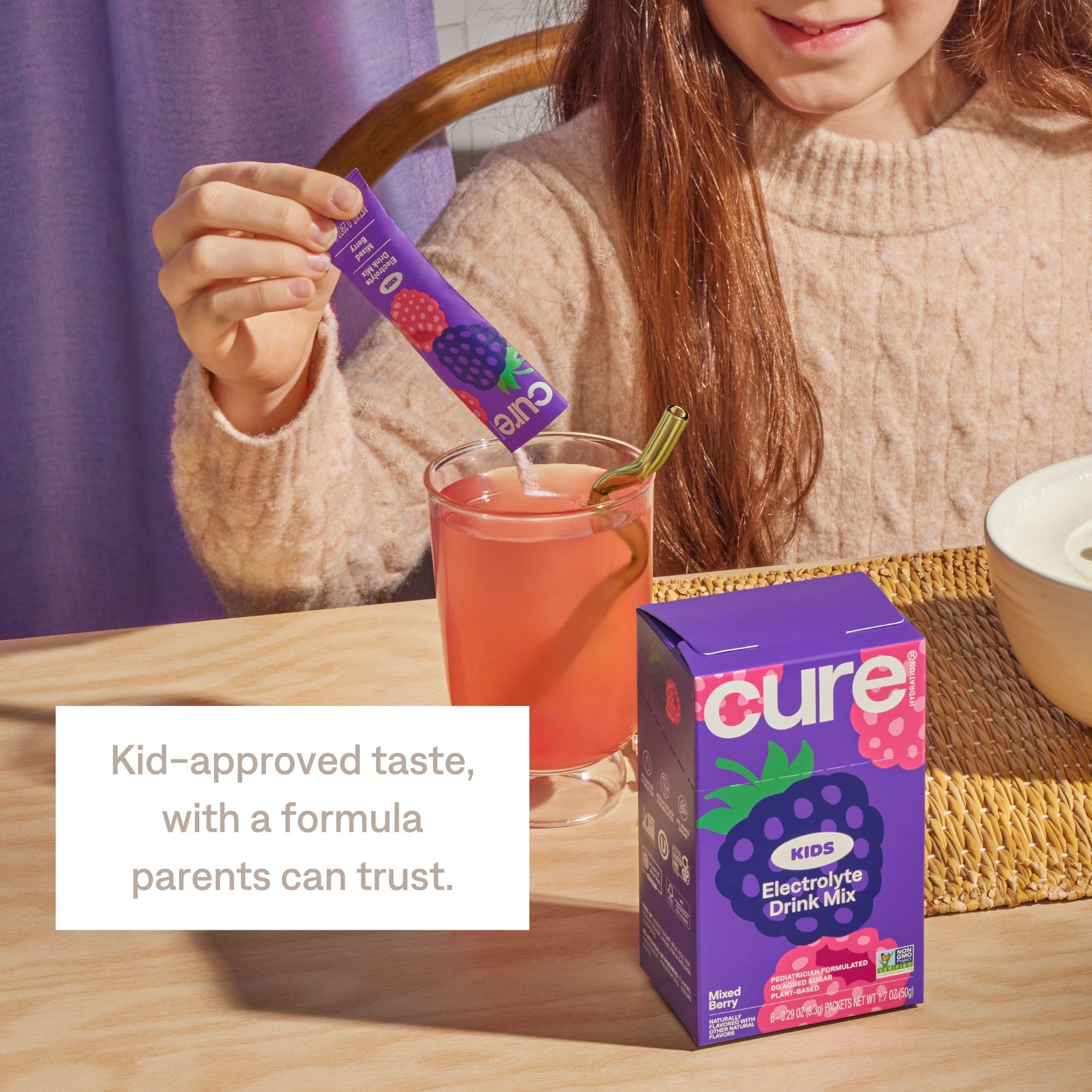 Cure Hydration served in child’s hand showing kid-approved flavor and hydration