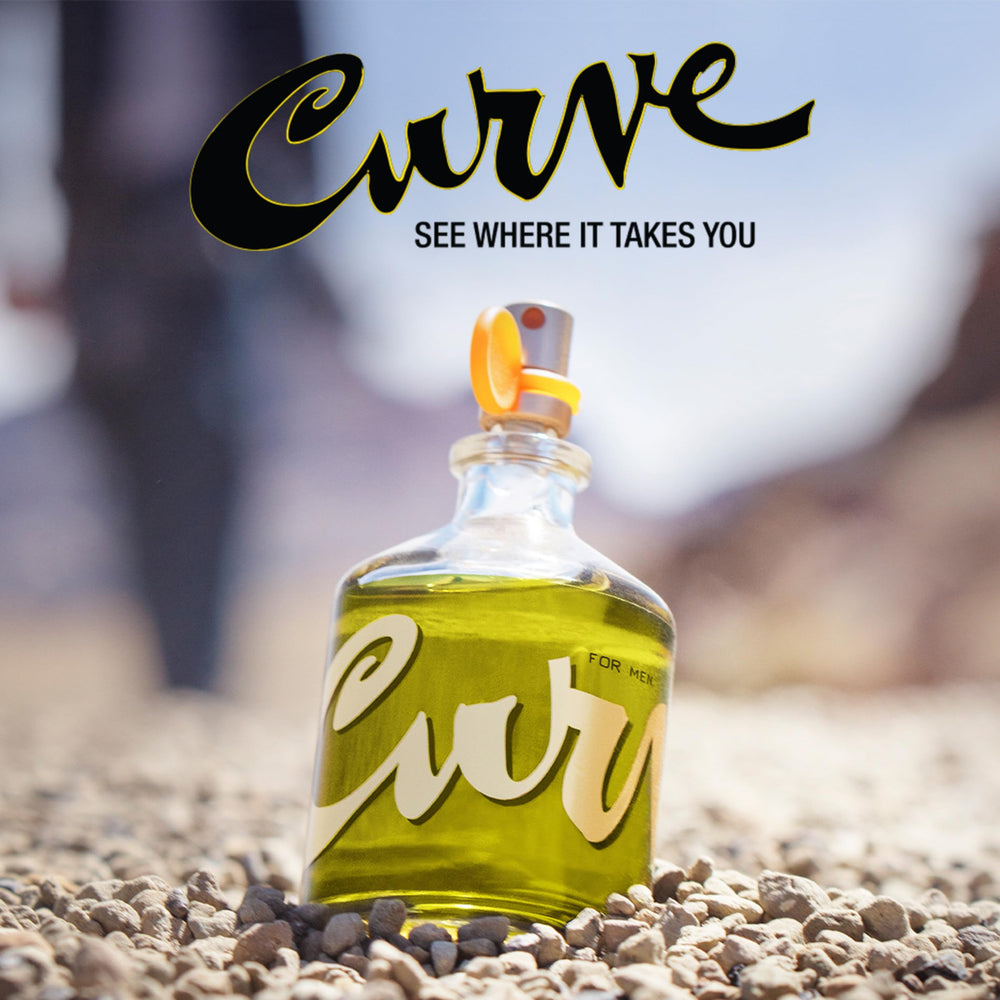 Curve bottle on wooden surface highlighting warm woody base character