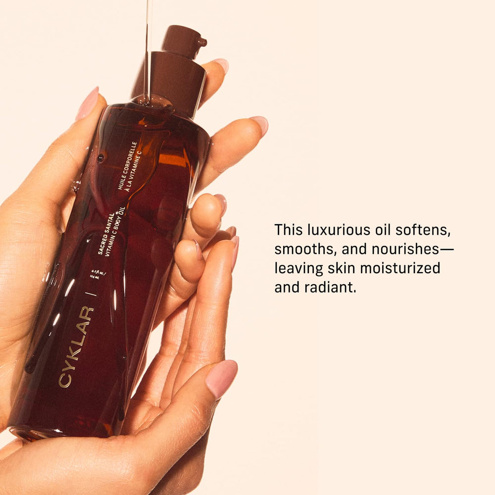 CYKLAR applying body oil on arm for quick hydration and smooth finish