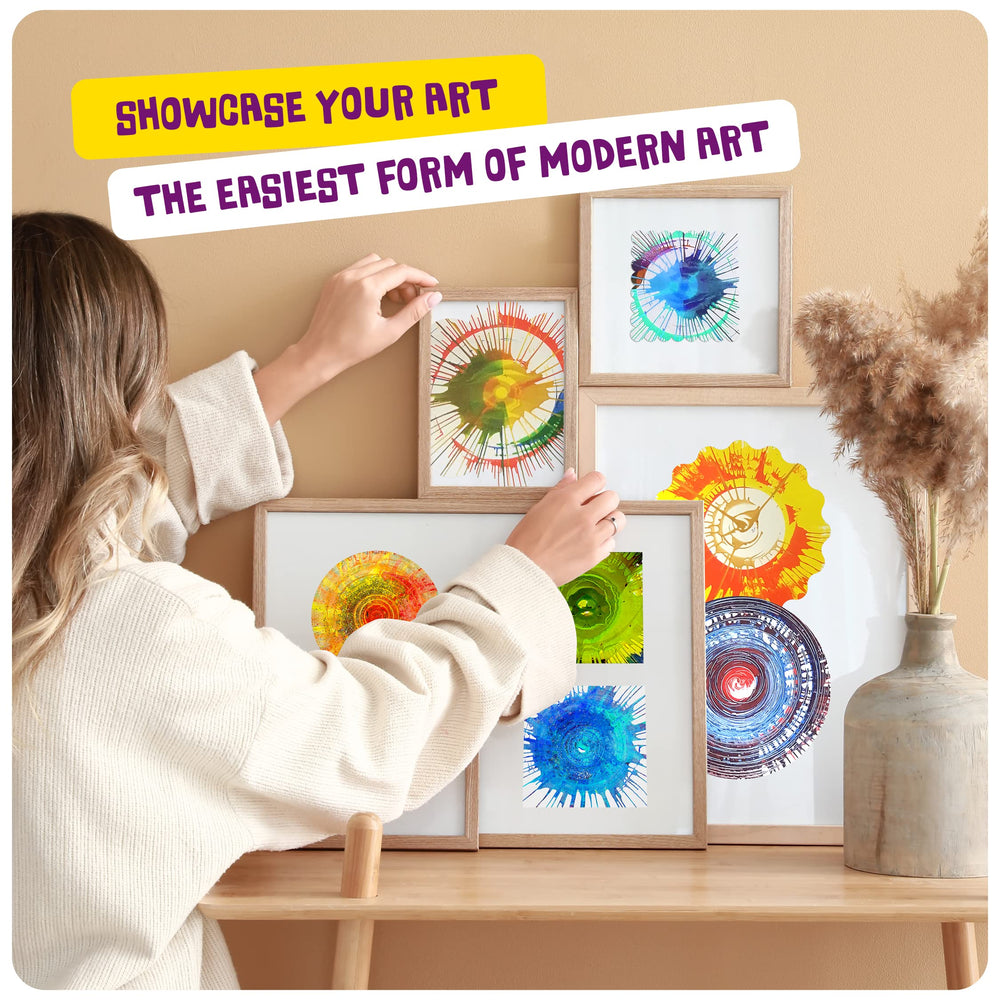 Dan&Darci turntable action shot capturing centrifugal paint vortex and dynamic patterns